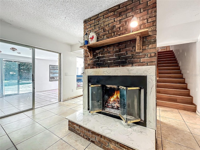 interior details featuring a textured ceiling and a fireplace