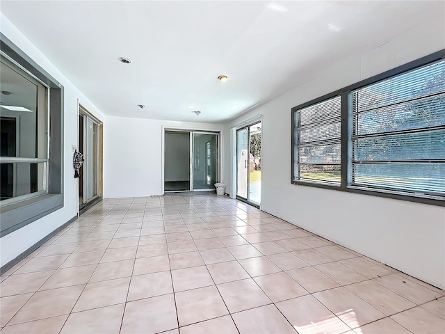 unfurnished room featuring light tile patterned floors