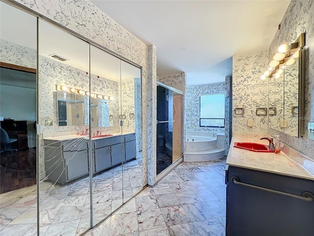 full bath featuring wallpapered walls, visible vents, and a sink