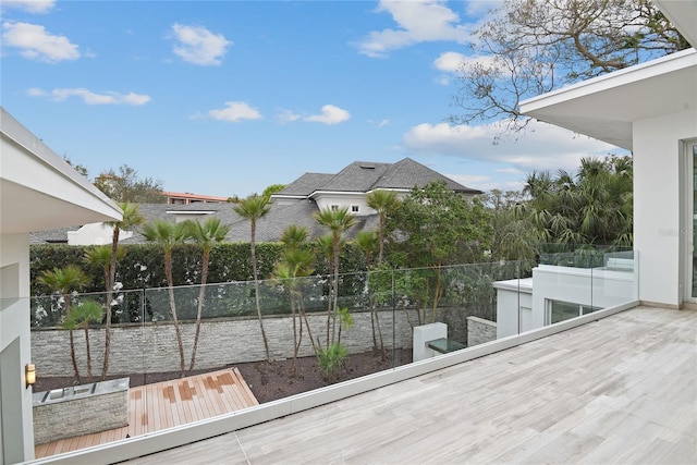 wooden terrace featuring fence