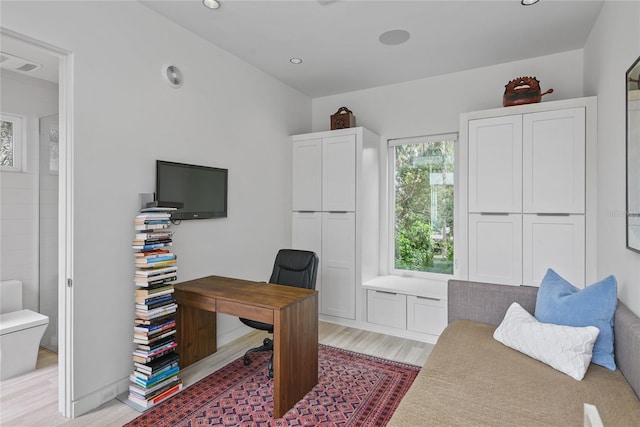 office space featuring light wood finished floors, visible vents, and recessed lighting