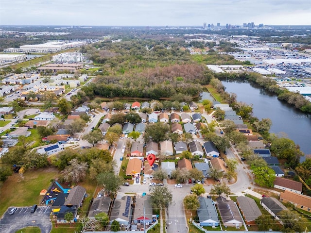 birds eye view of property with a water view and a residential view