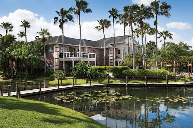 surrounding community featuring a yard and a water view