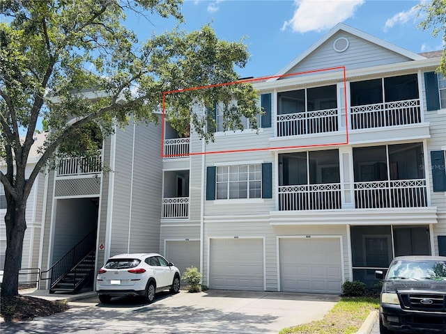 5017 City St Unit 1932, Orlando, FL 32839 - view of front facade featuring an attached garage and driveway