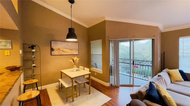 5017 City St Unit 1932, Orlando, FL 32839 - dining room with wood finished floors, crown molding, and lofted ceiling