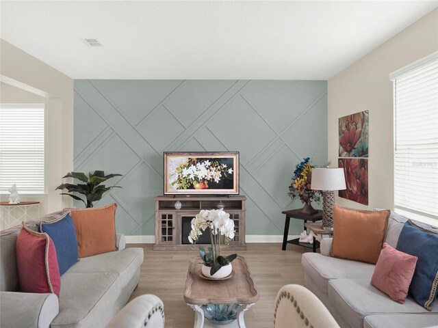 living room featuring light wood-style floors and baseboards