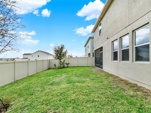 view of yard with a fenced backyard