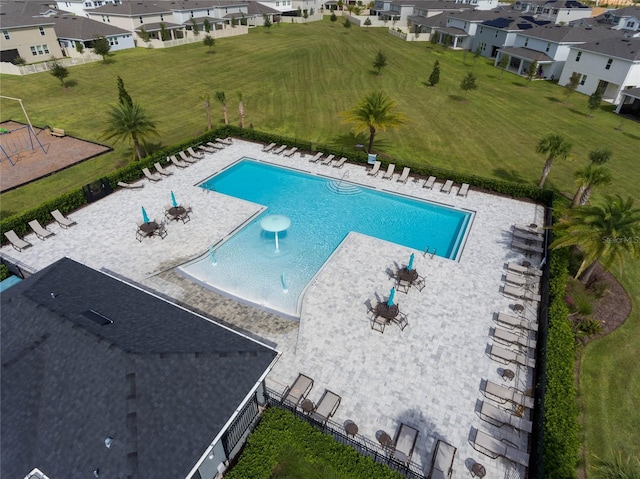 pool featuring a patio area, a residential view, and fence