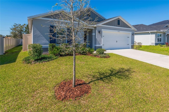 1546 Park Leah Cir, Apopka, FL 32712 - view of front facade featuring concrete driveway, an attached garage, fence, a front lawn, and board and batten siding