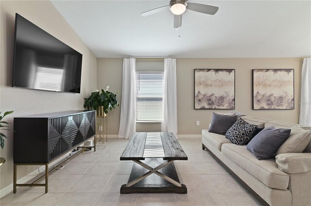1546 Park Leah Cir, Apopka, FL 32712 - living room featuring ceiling fan, a textured ceiling, baseboards, and light tile patterned floors