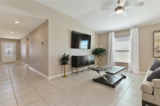 1546 Park Leah Cir, Apopka, FL 32712 - living room featuring ceiling fan, vaulted ceiling, baseboards, and light tile patterned floors