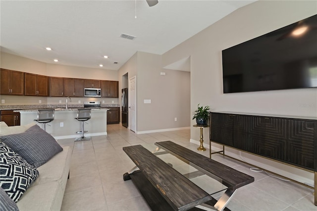 1546 Park Leah Cir, Apopka, FL 32712 - living room with light tile patterned floors, ceiling fan, recessed lighting, visible vents, and baseboards