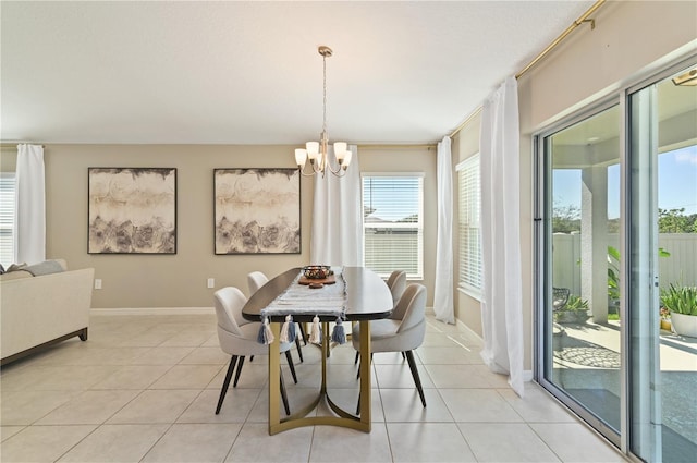 1546 Park Leah Cir, Apopka, FL 32712 - dining area featuring a notable chandelier, baseboards, and light tile patterned floors
