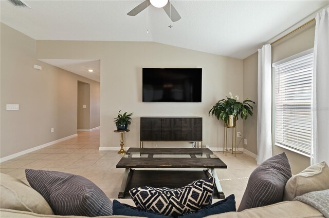 1546 Park Leah Cir, Apopka, FL 32712 - living area featuring lofted ceiling, light tile patterned flooring, and baseboards