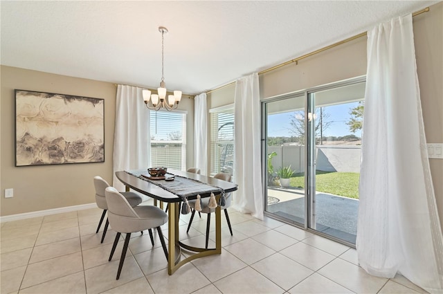 1546 Park Leah Cir, Apopka, FL 32712 - dining space featuring an inviting chandelier, baseboards, a textured ceiling, and light tile patterned flooring