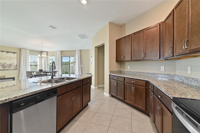 1546 Park Leah Cir, Apopka, FL 32712 - kitchen with light stone counters, light tile patterned floors, visible vents, a sink, and dishwasher