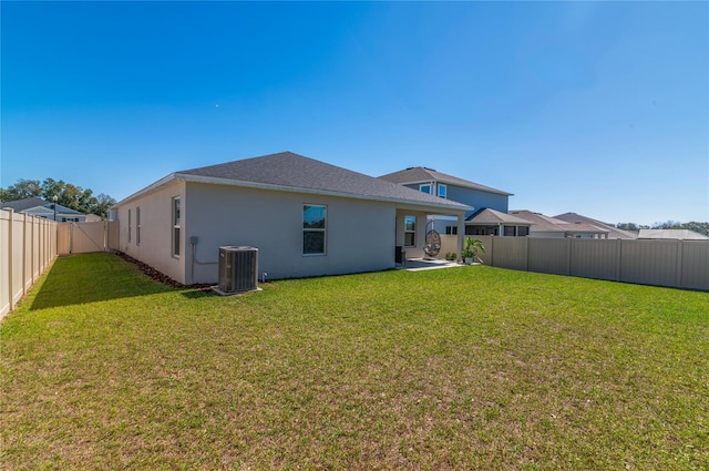 1546 Park Leah Cir, Apopka, FL 32712 - back of house with a patio, a fenced backyard, central air condition unit, a lawn, and stucco siding
