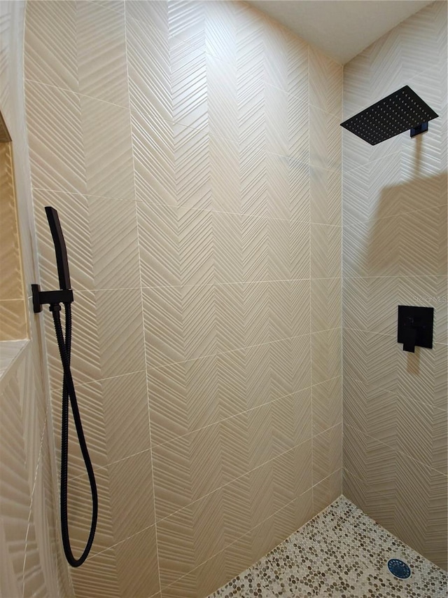 bathroom with tiled shower