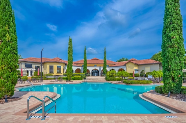 community pool featuring a patio