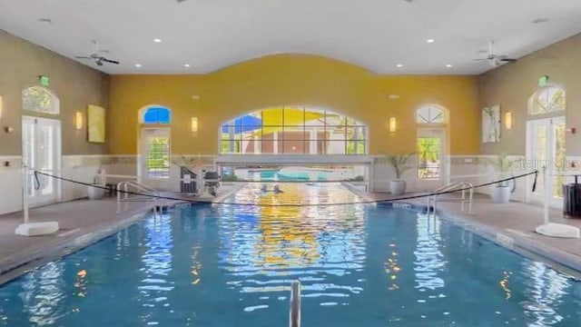 view of pool featuring ceiling fan and french doors