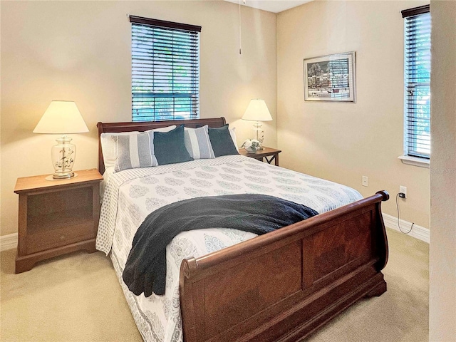 bedroom with light colored carpet