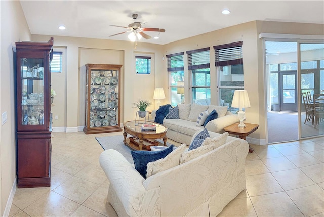 tiled living room featuring a wealth of natural light and ceiling fan