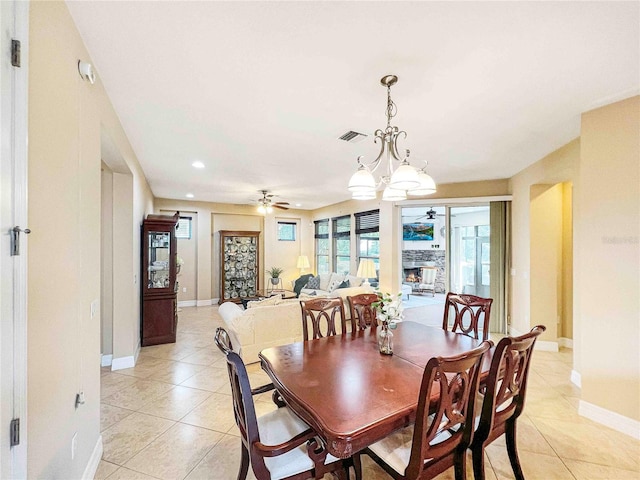 dining room featuring ceiling fan and light tile patterned floors