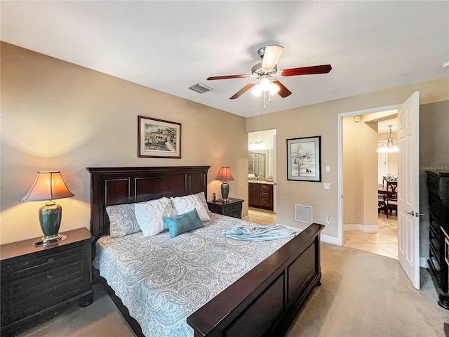 bedroom with ensuite bathroom and ceiling fan