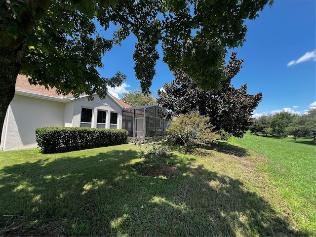 view of yard featuring a lanai