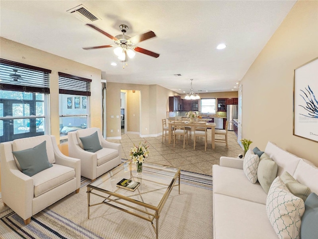172 Balmy Coast Rd, Groveland, FL 34736 - living room featuring a ceiling fan, a chandelier, and recessed lighting