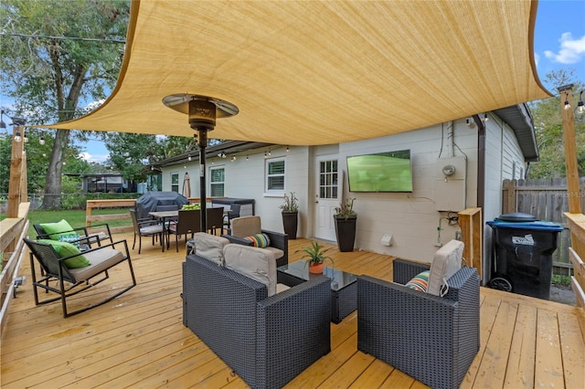 wooden deck featuring outdoor lounge area