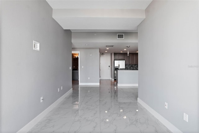 101 S Eola Dr Unit 1001, Orlando, FL 32801 - unfurnished living room with visible vents, baseboards, and marble finish floor