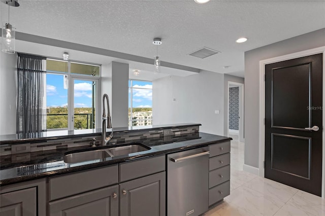 101 S Eola Dr Unit 1001, Orlando, FL 32801 - kitchen with marble finish floor, pendant lighting, a sink, dark stone counters, and dishwasher