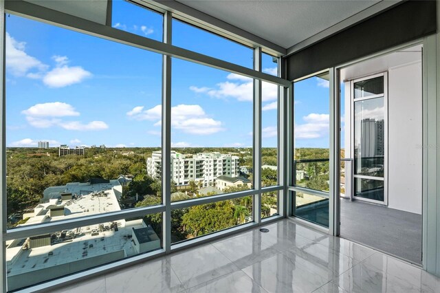 101 S Eola Dr Unit 1001, Orlando, FL 32801 - unfurnished sunroom with a city view