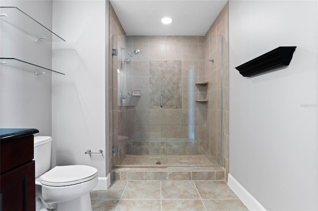 101 S Eola Dr Unit 1001, Orlando, FL 32801 - bathroom featuring tile patterned flooring, a shower stall, toilet, and vanity