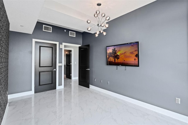 101 S Eola Dr Unit 1001, Orlando, FL 32801 - spare room with an inviting chandelier, baseboards, visible vents, and marble finish floor