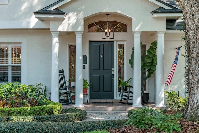 entrance to property with stucco siding