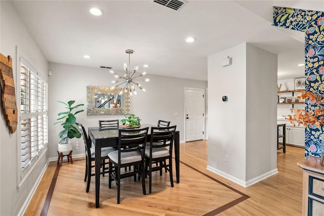 dining area featuring light wood-style floors, baseboards, visible vents, and recessed lighting