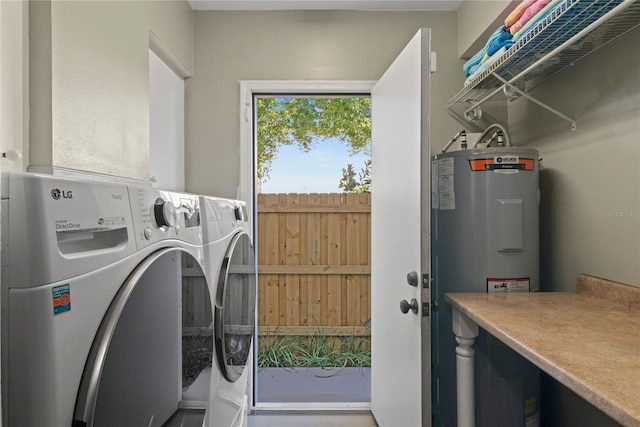 laundry room featuring washer and dryer, laundry area, and water heater