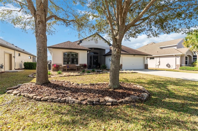 ranch-style house featuring a front yard and a garage