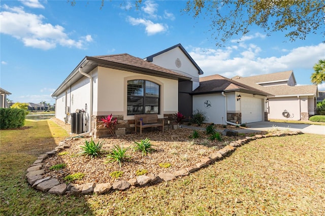 view of front of property with a garage and a front yard