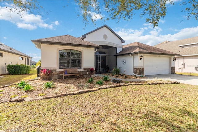 view of front of home featuring a front yard and a garage