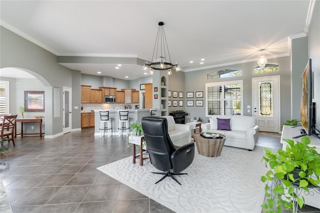 living room featuring tile patterned floors and crown molding