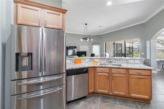 kitchen featuring sink, ornamental molding, stainless steel appliances, and tile patterned floors