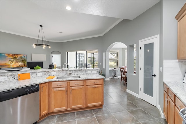 kitchen with sink, backsplash, light stone countertops, and dishwasher