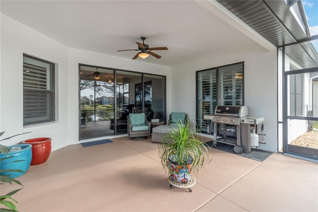 view of patio with ceiling fan and a grill