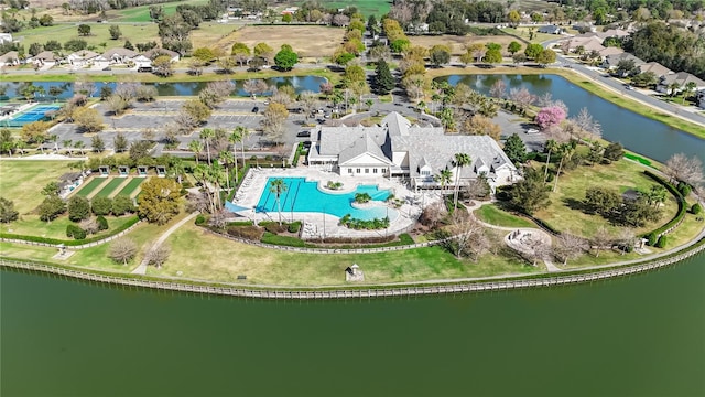 birds eye view of property with a water view