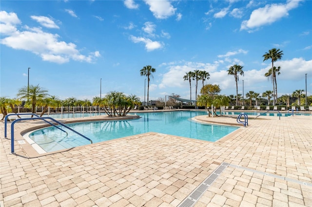 view of swimming pool with a patio area