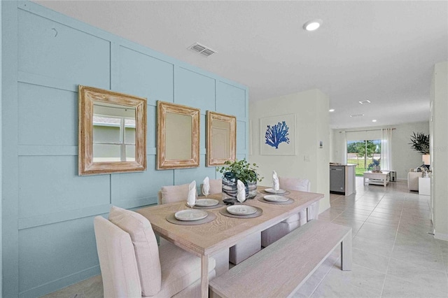 dining area with light tile patterned flooring