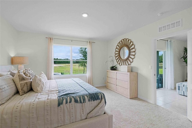 bedroom with light carpet